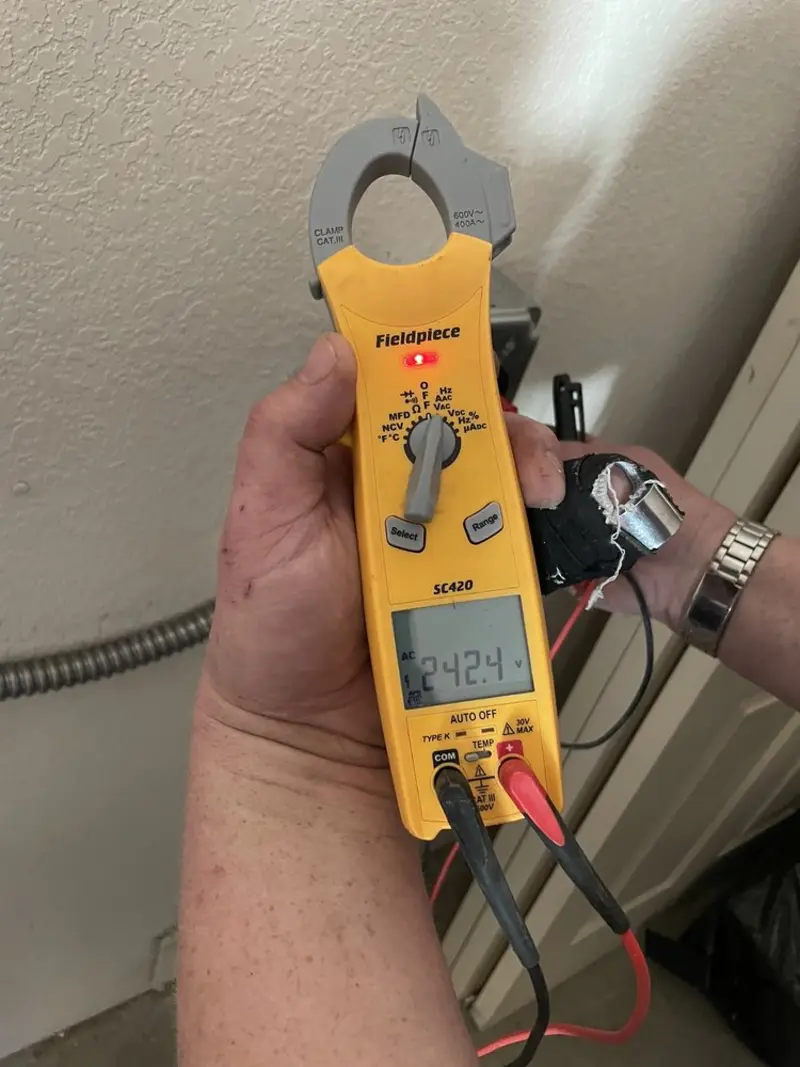 Voltage testing with clamp meter during Outlet Installation in Jackson